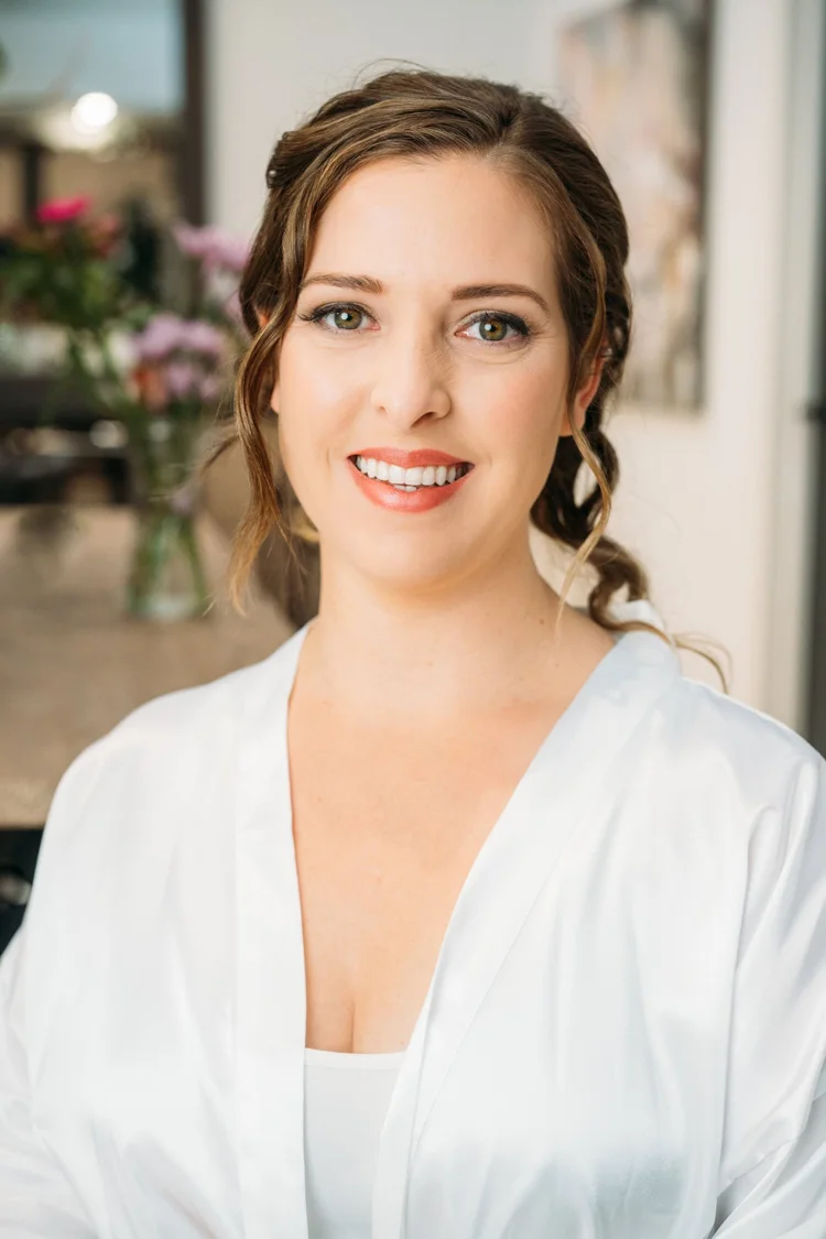 Fresh bridal makeup with softly defined eyes and a pink lip.