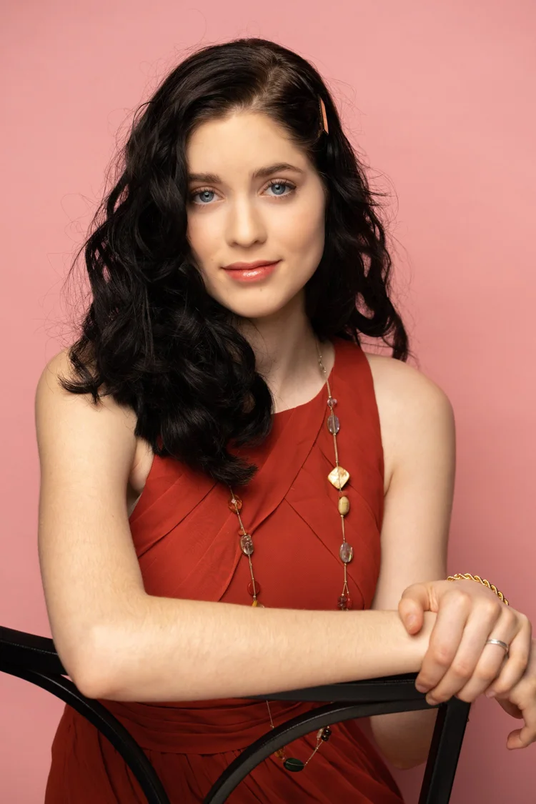 Portrait makeup with defined eyes and a softly coloured lip.